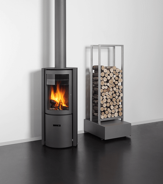 Black Stuv 30 Compact wood fireplace with a low, modern design, showcasing a sleek black exterior and glass front.