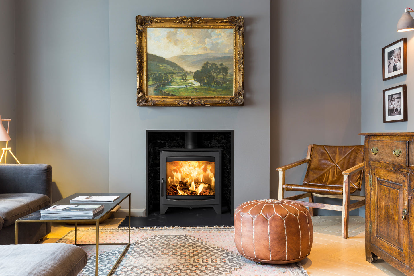 Hunter Stoves Parkray Aspect 14 Eco wood fireplace with black handle and standard legs, showcasing a sleek black exterior and sturdy construction.