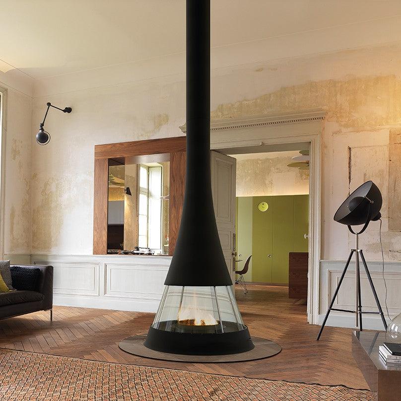 Black Bordelet Linea 914 Central wood fireplace with sleek design, shown in a modern living room setting.