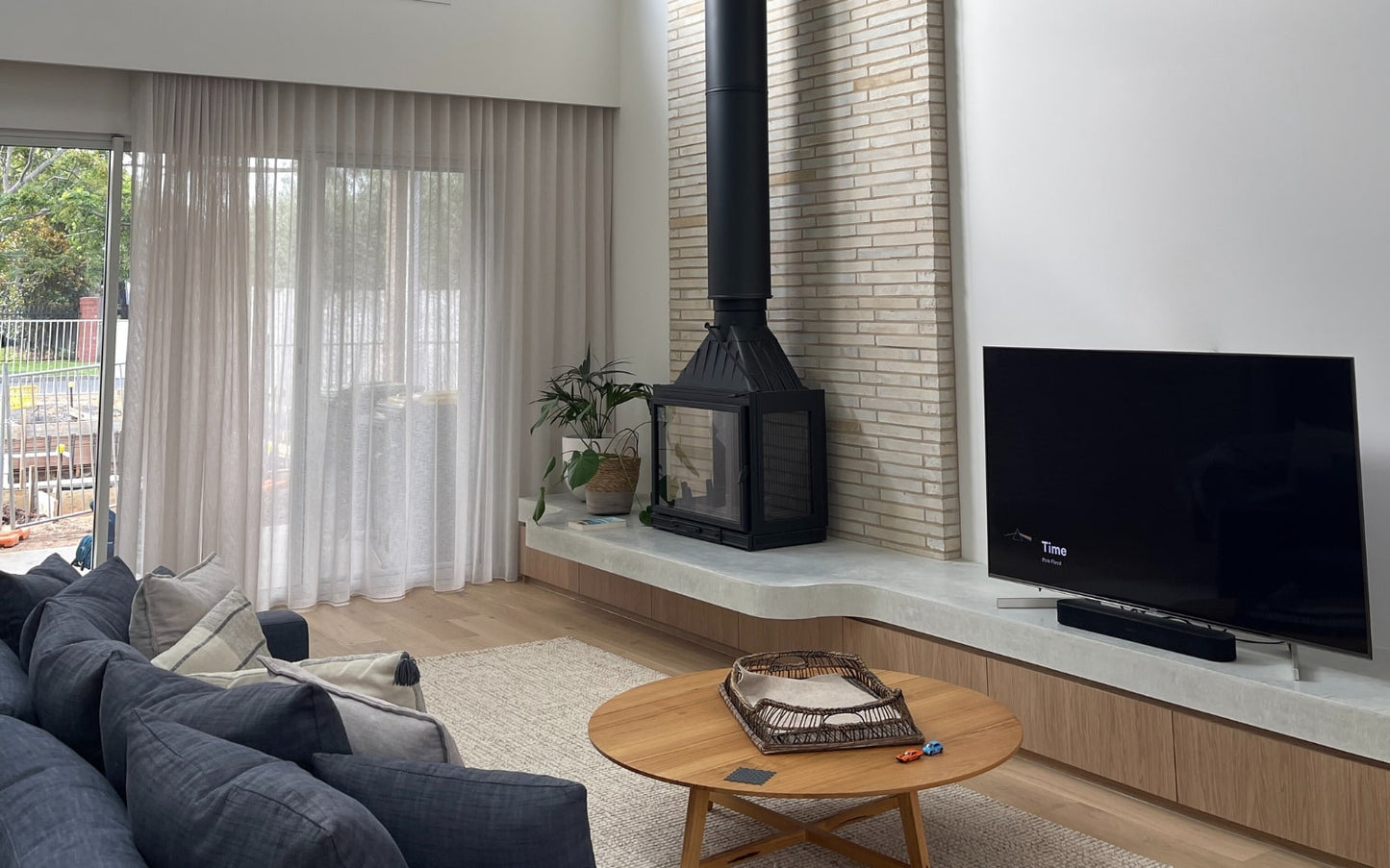 Seguin MultiVision 8000 double-sided wood fireplace with glass panels showcasing a modern, open-front design and warm interior.
