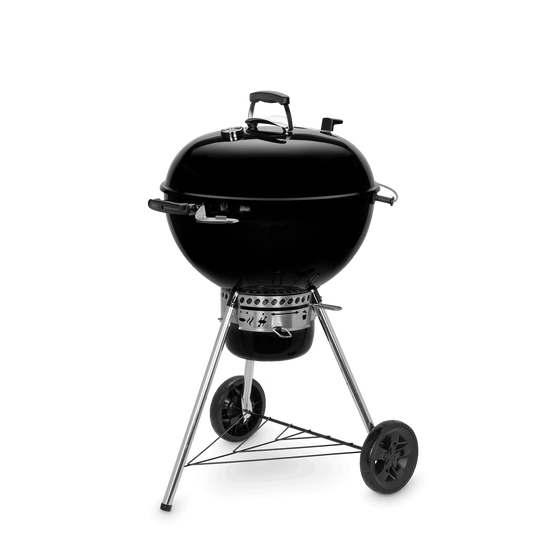 Black Weber Master-Touch 57cm kettle grill with lid handle and cooking grate, ideal for outdoor barbecues and grilling.