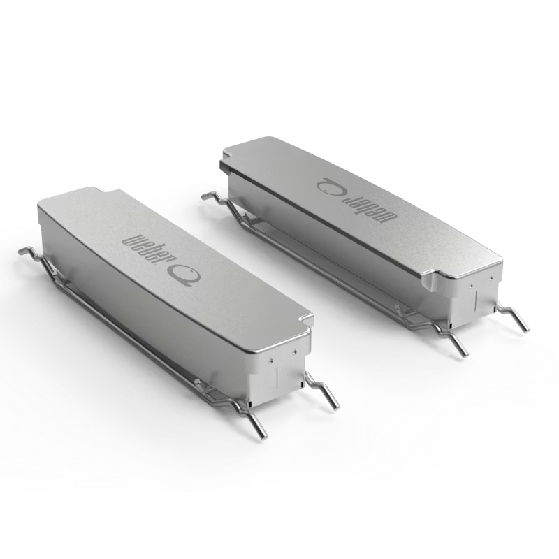 Weber Q and Family Q smoker box set for outdoor smoking, featuring durable metal construction and compact design.