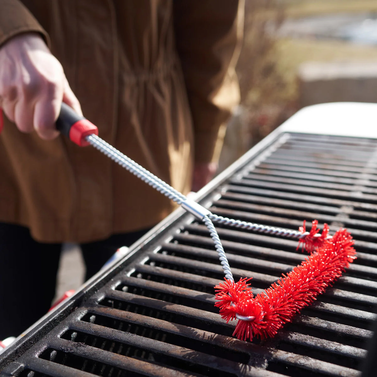 Large Weber Cold Cleaning Grill Brush for BBQ and fireplace maintenance, with sturdy bristles and ergonomic handle.