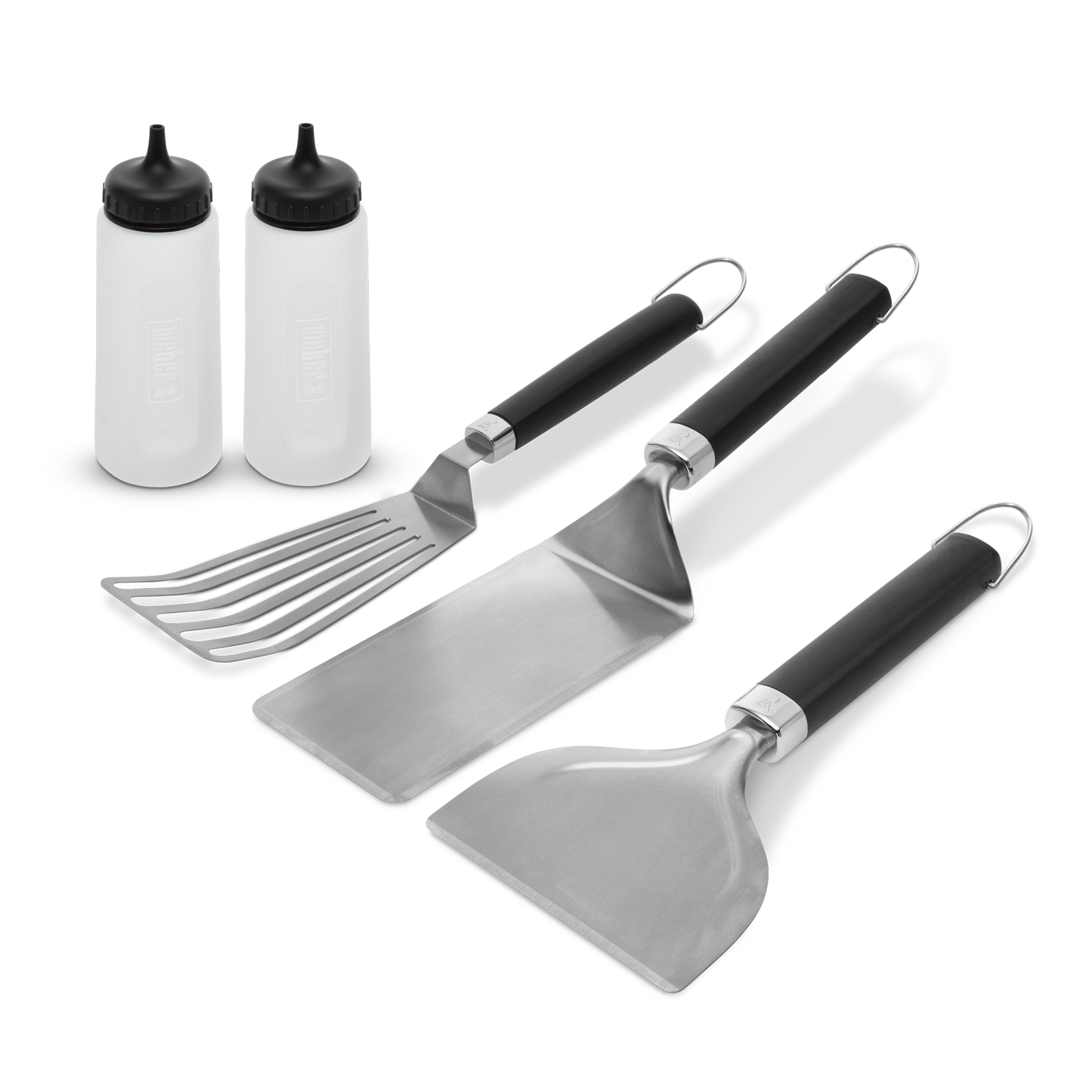 Weber Griddle Essentials Set of cooking utensils and tools for griddle cooking, including spatula, tongs, and scraper.