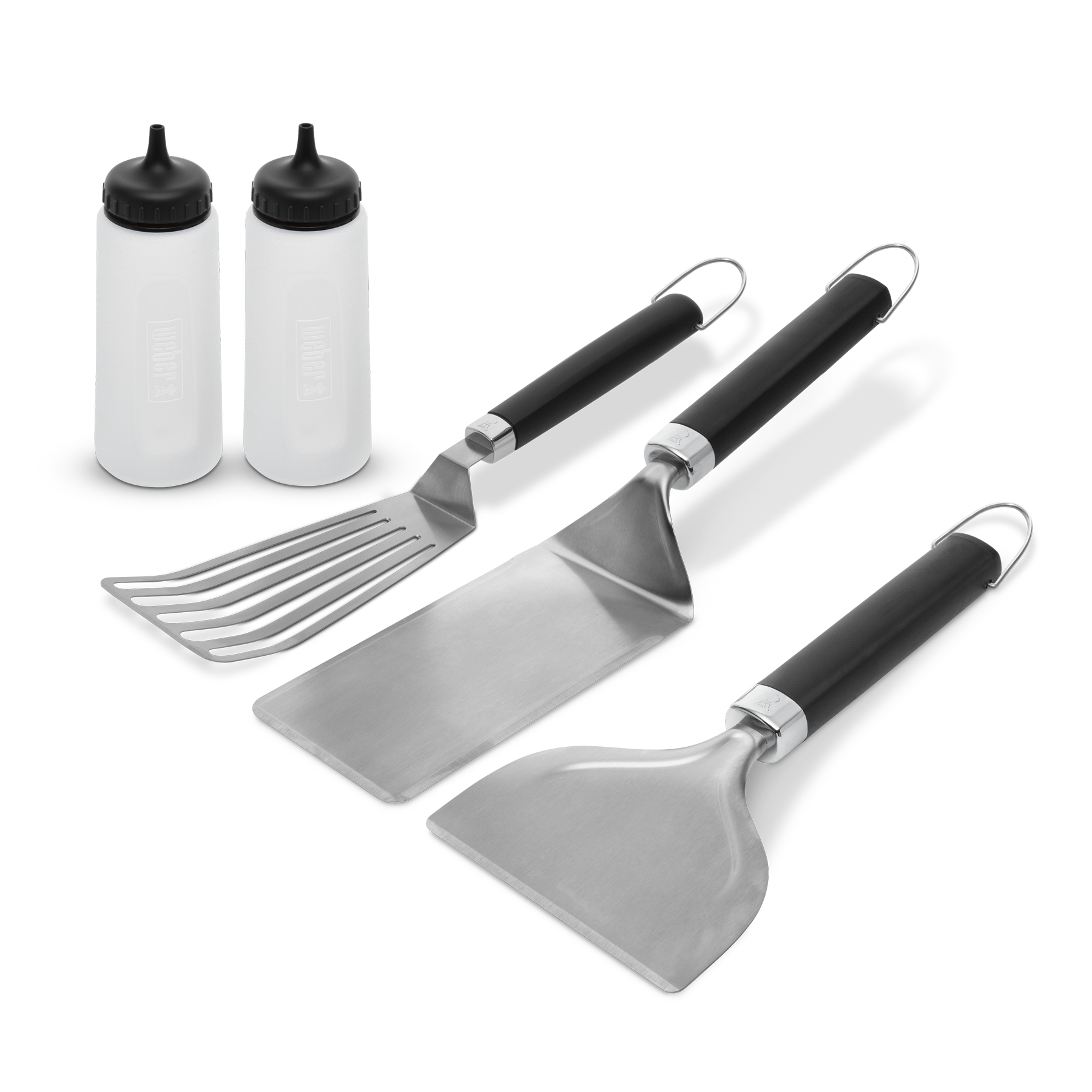 Weber Griddle Essentials Set of cooking utensils and tools for griddle cooking, including spatula, tongs, and scraper.
