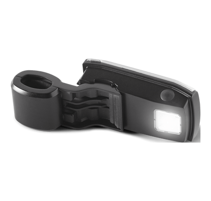 Weber Grill n Go handle light attached to a portable grill cart, providing illumination for outdoor grilling in low light.