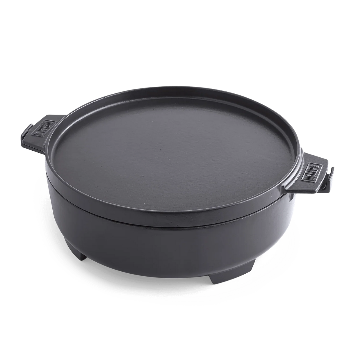 Weber GBS Dutch Oven from Gourmet Barbecue System set, shown on a black grill with lid, perfect for outdoor cooking and baking.