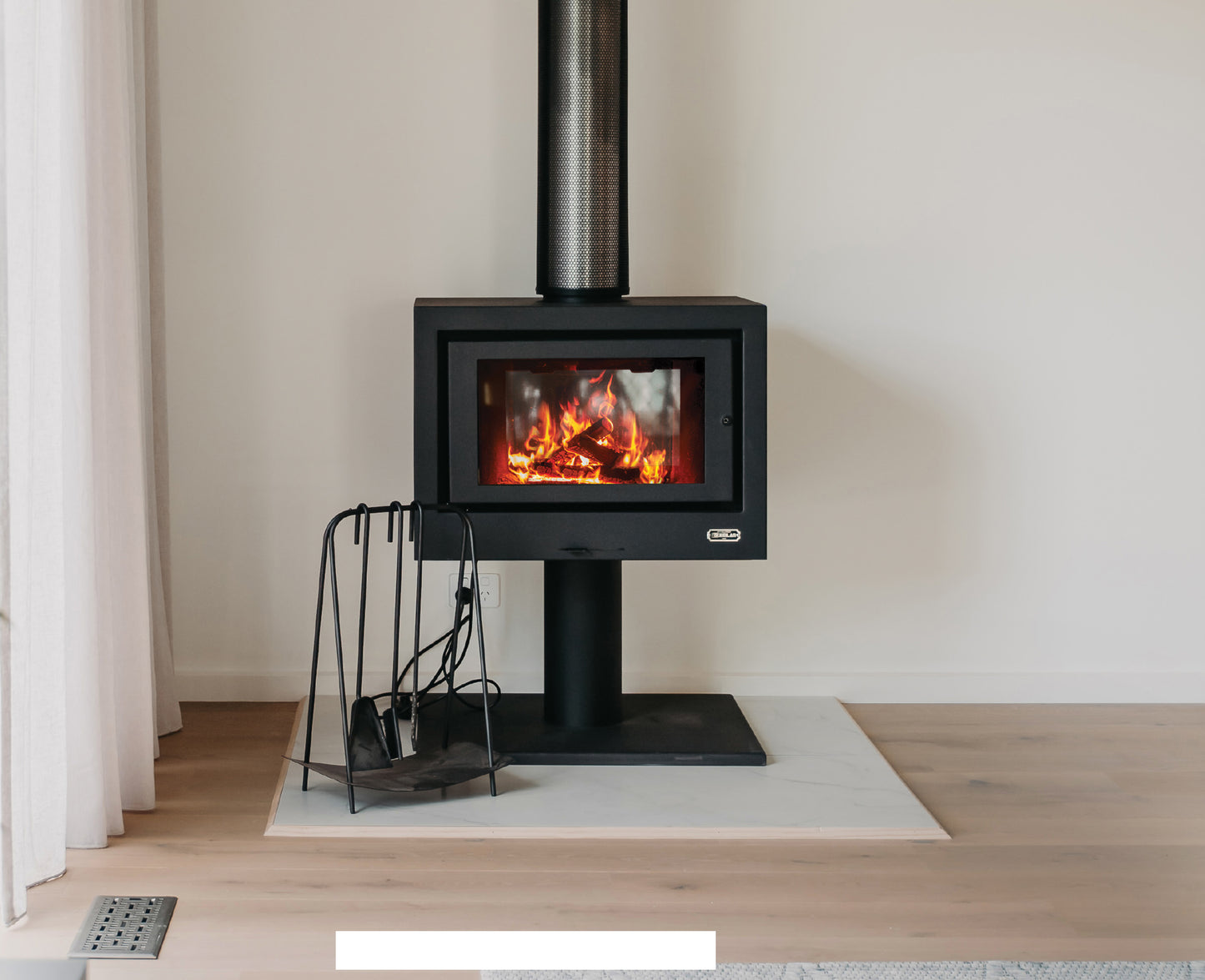 Kemlan black Cube Freestander with sphere base, modern wood fireplace with geometric design and sleek black finish.