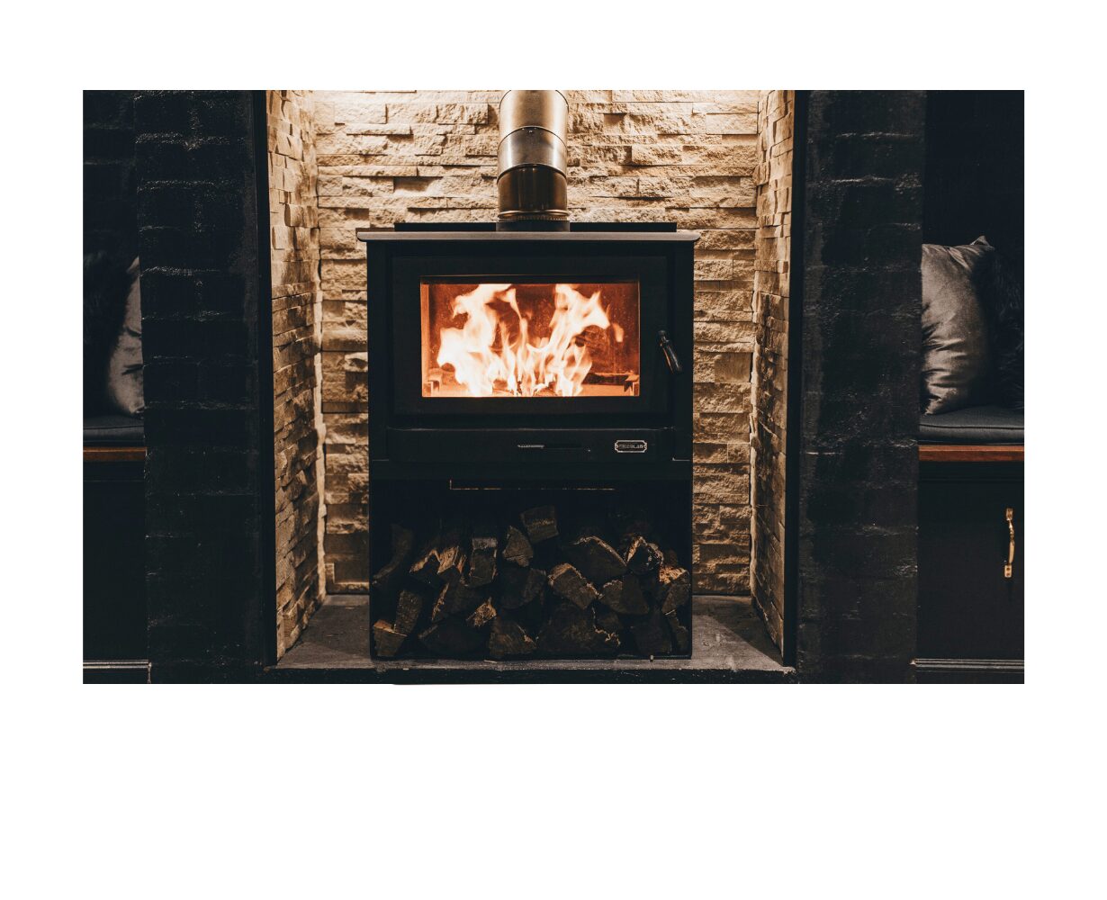 Kemlan Tempo Grand wood fireplace with Meridian base, freestanding design, featuring a sleek modern appearance and glass front.