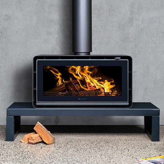 Kalora Urban LS wood fireplace with a sleek plinth design, featuring modern black finish and clean lines.