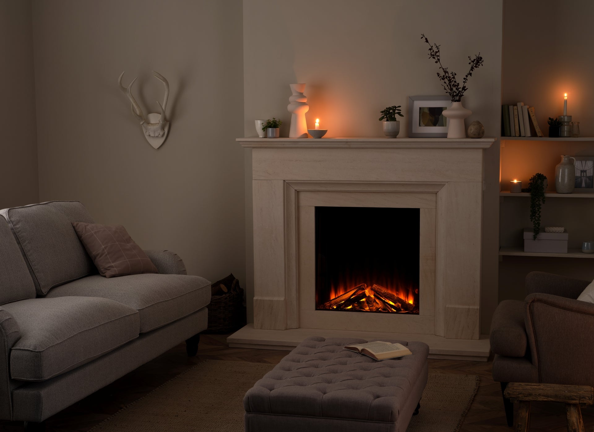 British Fires New Forest 650 SQ Deluxe electric fireplace with realistic log display in a cozy living room setting