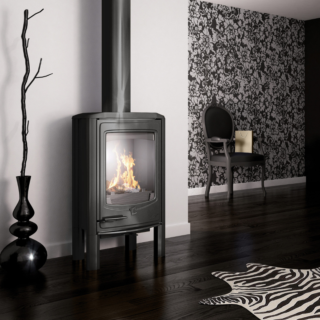 Seguin Jade grey freestanding wood stove with glass door and metal handle, designed for indoor fireplaces.