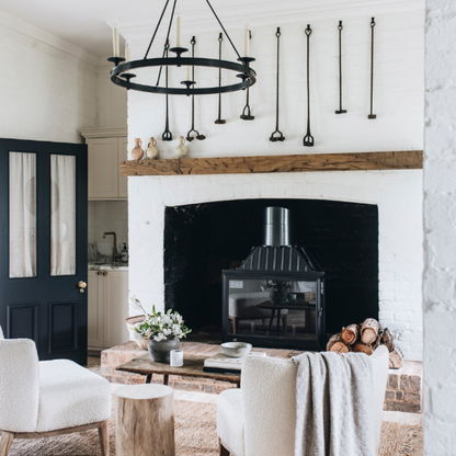 Seguin Super 9 cast iron wood fireplace with black line glass, showcasing its sleek design and sturdy construction.