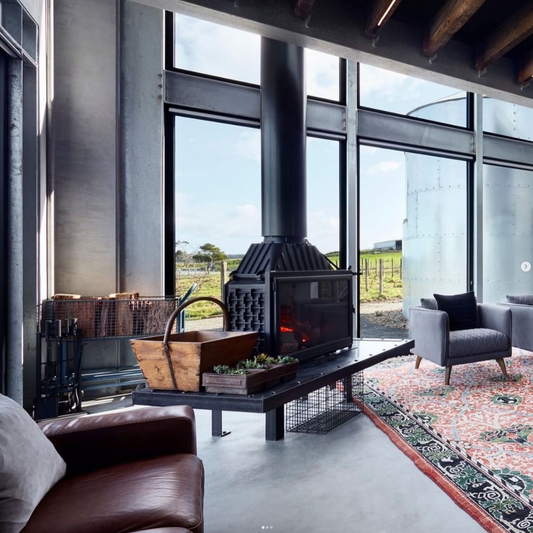 Seguin Super 9 cast iron wood fireplace with black line glass, showcasing its sleek design and sturdy construction.