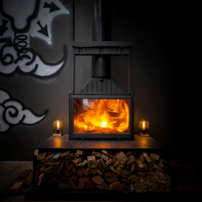 Seguin Super 9 cast iron wood fireplace with black line glass lift, showcasing a classic, stylish design for cozy wood fires.