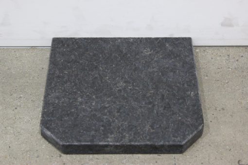 Haus Fire flat wall hearth in urban black granite, square design with 1250mm dimensions, suitable for modern urban fireplaces.