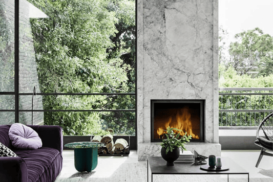 Stuv 21-95 wood fireplace showing a modern black metal design with glass doors and a fire burning inside.
