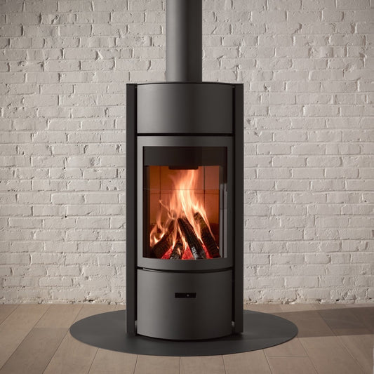 Open door view of STUV Stuv 30 wood fireplace showing the interior and flame for warm, cozy heating.