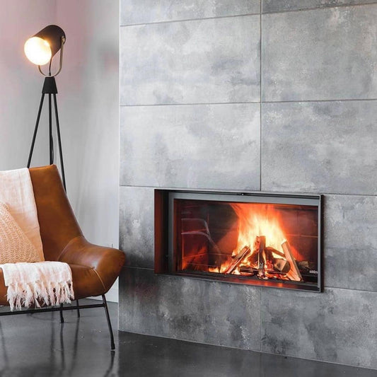 Stuv 21 wood fireplace with dark interior and grey exterior, modern design, showcasing the sleek fireplace front and interior.