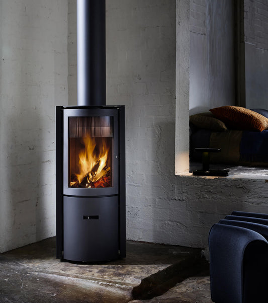 Stuv 30 Compact black wood fireplace with sleek design and slow combustion feature, ideal for modern home heating.