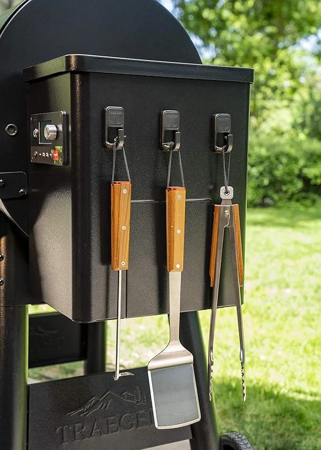 Traeger magnetic wooden hooks for BBQ accessories, featuring titanium plating, ideal for organizing grilling tools.