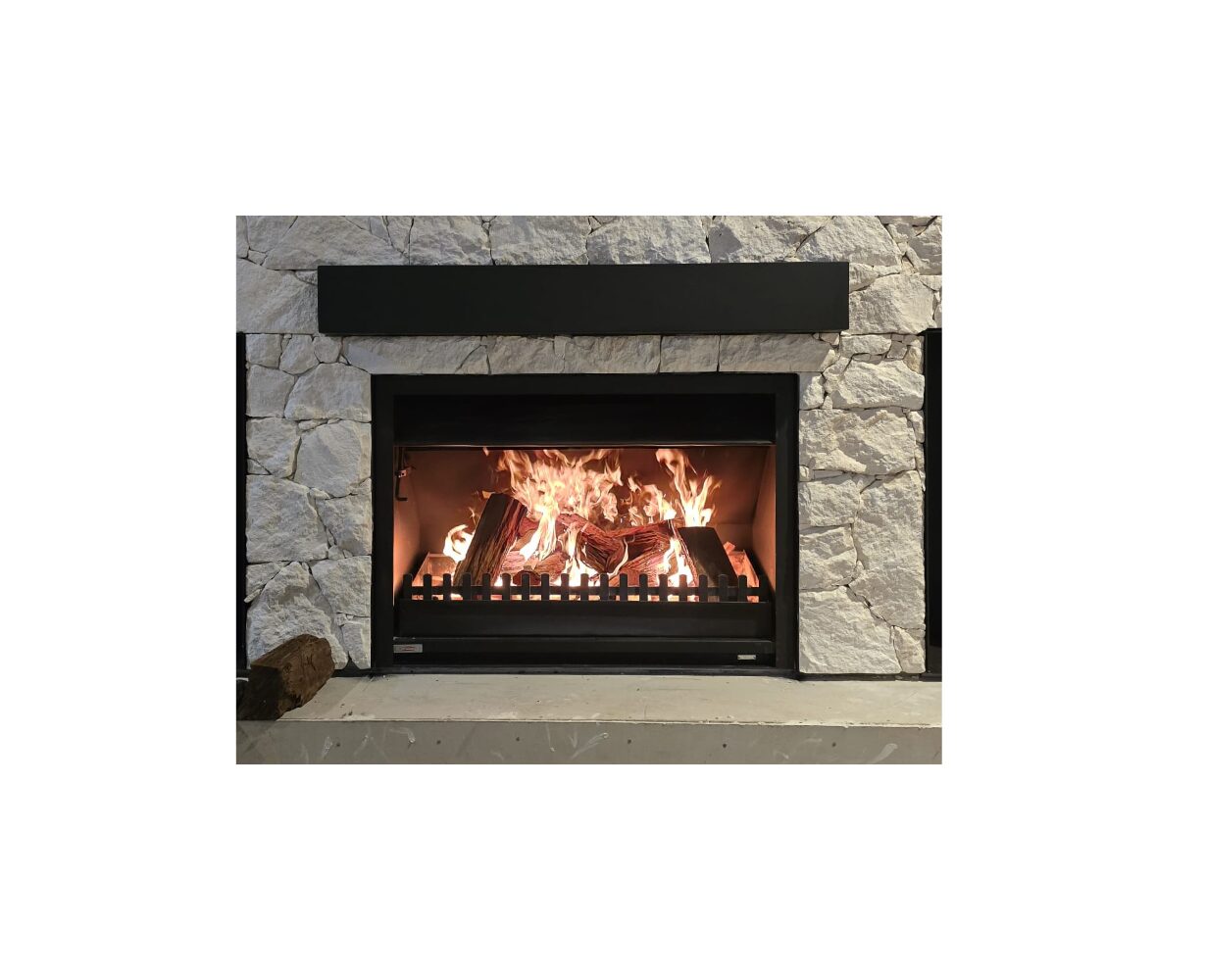 Jetmaster wood fireplace insert with instruction manual, showing the sleek black metal unit and installation guide.