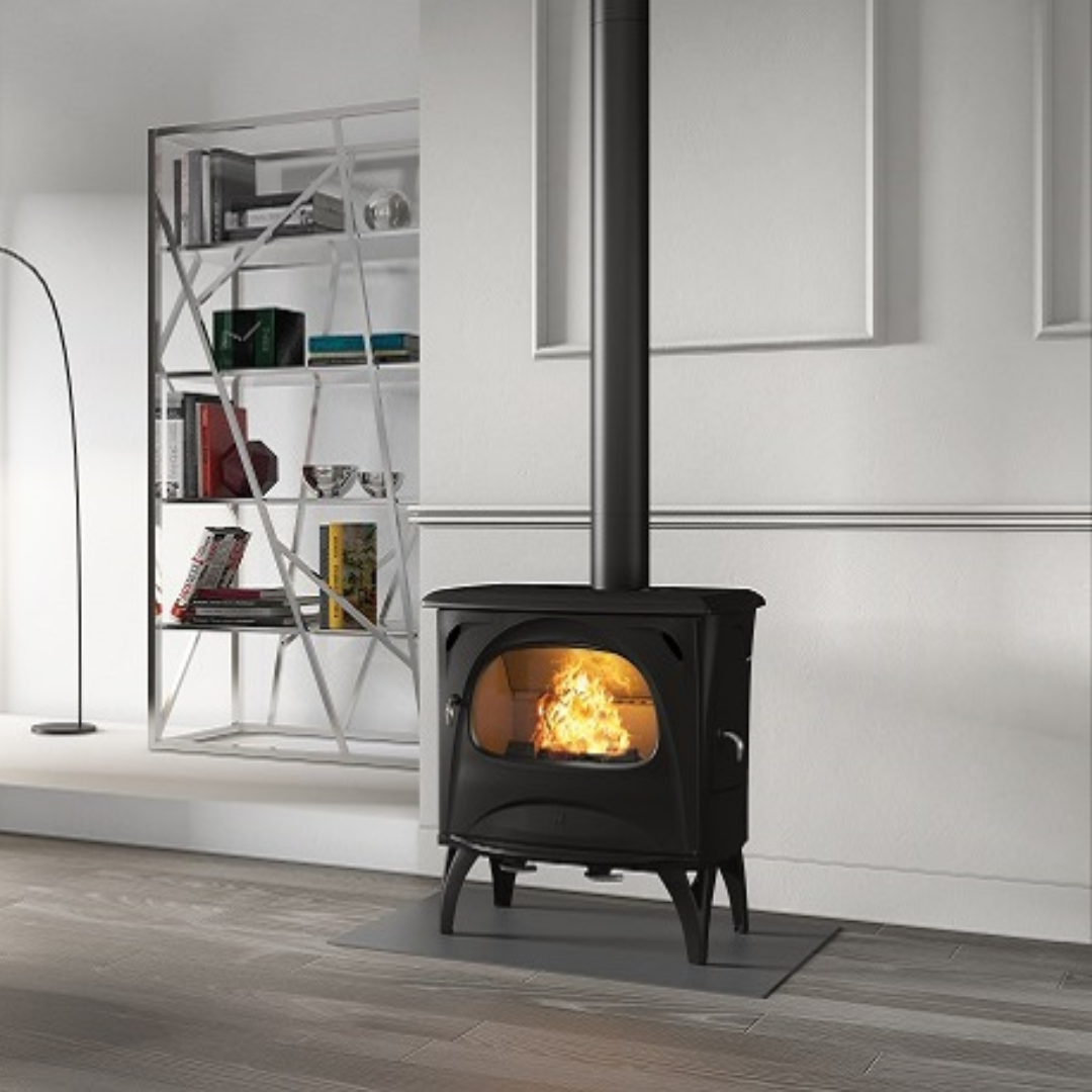 Seguin Aurore freestanding black wood stove with glass door and metal frame, designed for indoor fireplaces.