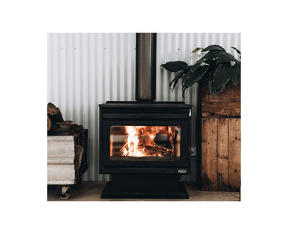 Kemlan XL Freestander wood fireplace in black with built-in fan, showcasing its sleek design and functional features.