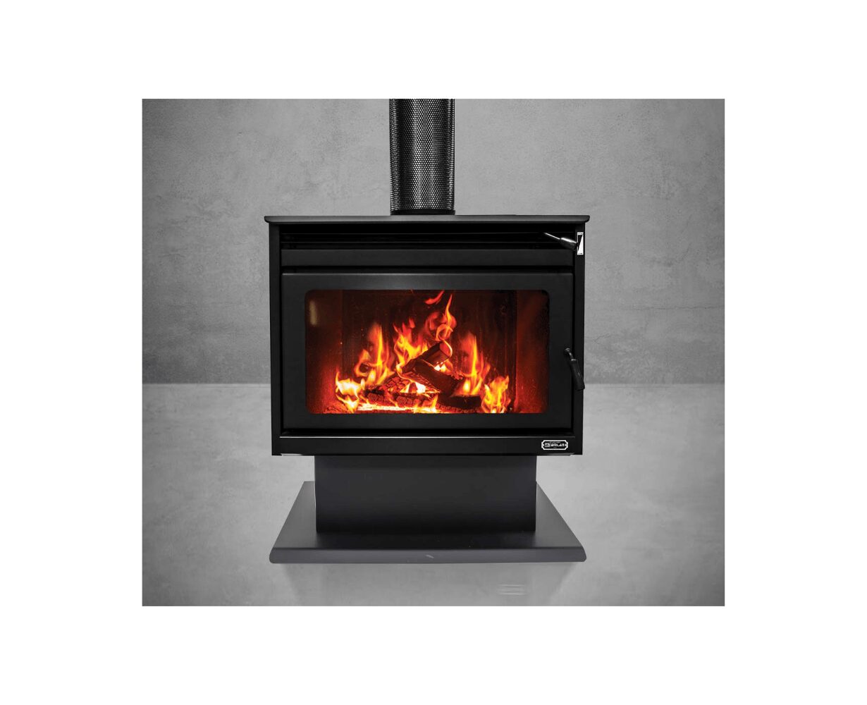 Kemlan KEMLAN XL Freestander wood fireplace in black with integrated fan for efficient heating, shown in a home setting.