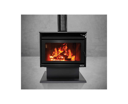 Kemlan KEMLAN XL Freestander wood fireplace in black with integrated fan for efficient heating, shown in a home setting.