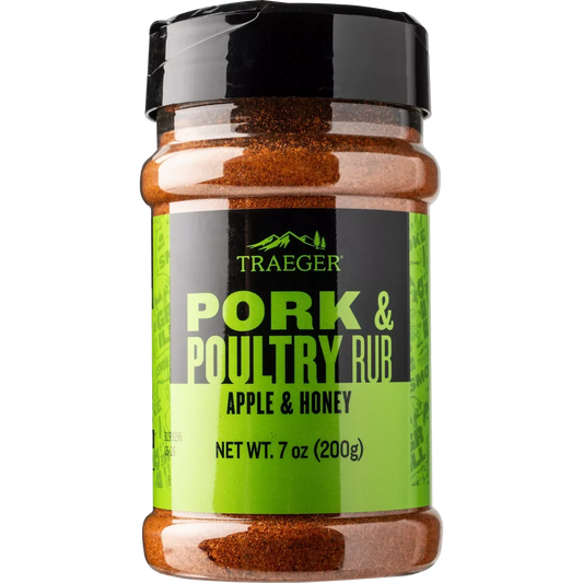 Traeger Pork & Poultry Rub in a jar, featuring a blend of spices for grilling and smoking meats, on a kitchen countertop.