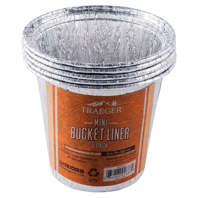 Traeger mini grease bucket liner, 5-pack, BBQ accessory from BBQ and Fireplace Centre, shown in front of packaging.