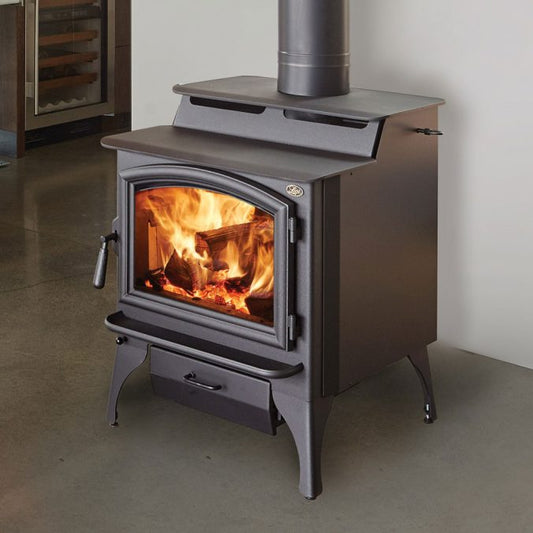 Lopi Endeavour 2020 wood fireplace with black legs, showcasing its sleek modern design and spacious firebox.