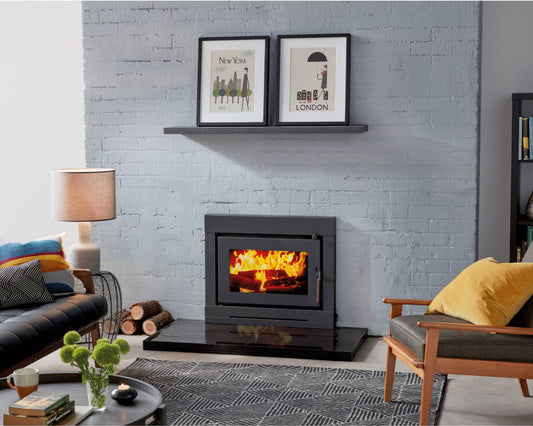 Maxiheat NOMAD metallic black wood fireplace insert with metal construction, designed for efficient heating and modern style.