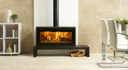 Regency Studio 2 freestanding wood fireplace with a modern design and glass front, ideal for heating and aesthetic appeal.